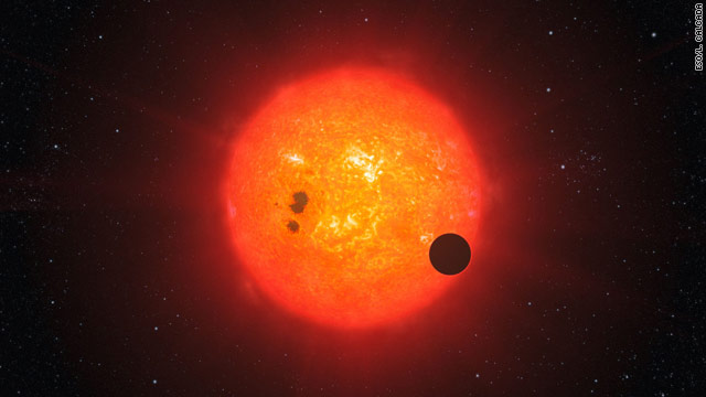 This illustration shows how the newly discovered planet may look orbiting its nearby star, which is smaller than Earth's sun.