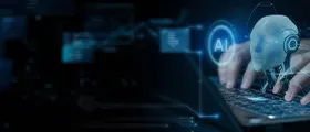 Human hands typing on a keyboard with a digital AI robot head 