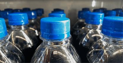 soda bottles with blue caps