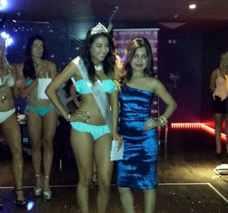 Beauty contest participants posing on stage