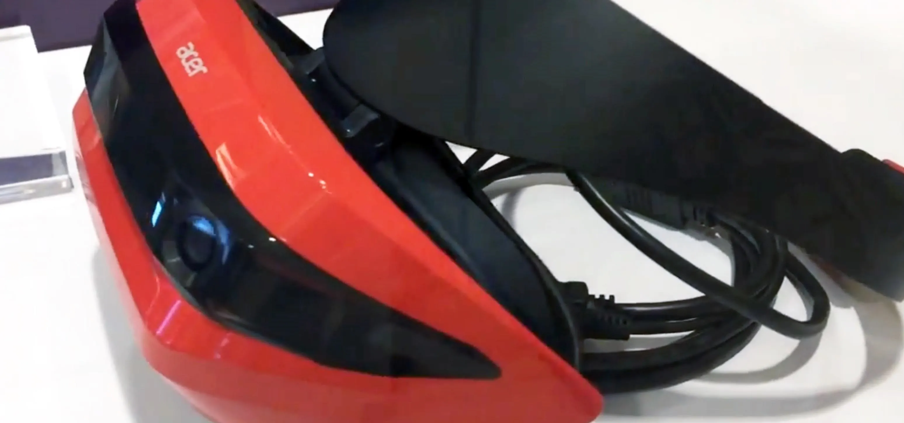Retro virtual reality headset in red and black.