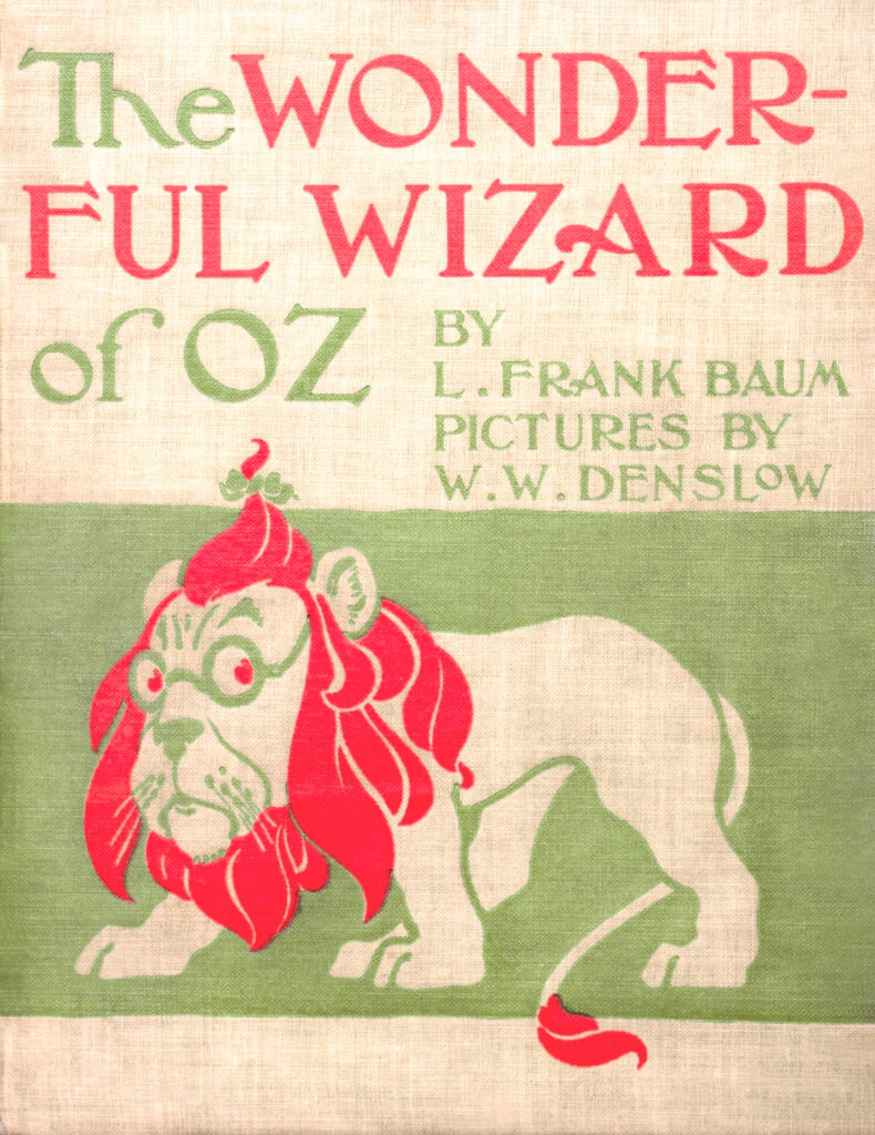 Green and read cover image with the Cowardly Lion. The text reads: The Wonderful Wizard of Oz by L. Frank Baum
Pictures by W. W. Denslow