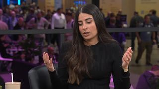 Asha Sharma in black sweater