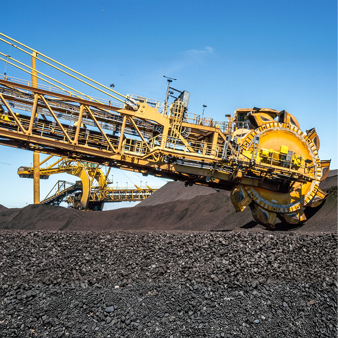 Large mining excavator operating at a coal extraction site during active operations.