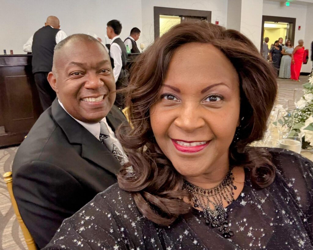 Cervical cancer survivor Alegra Woodard smiles with her husband while sharing her experience with cervical cancer in military families for Cervivor.