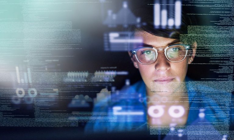 Screen data overlaying a female looking toward a computer screen