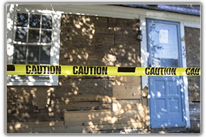 Trauma scene Cleaning cautioned taped off crime scene, caution taped off house