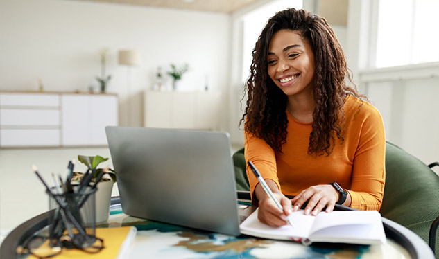 A woman taking notes from the SEO data for Google Business
