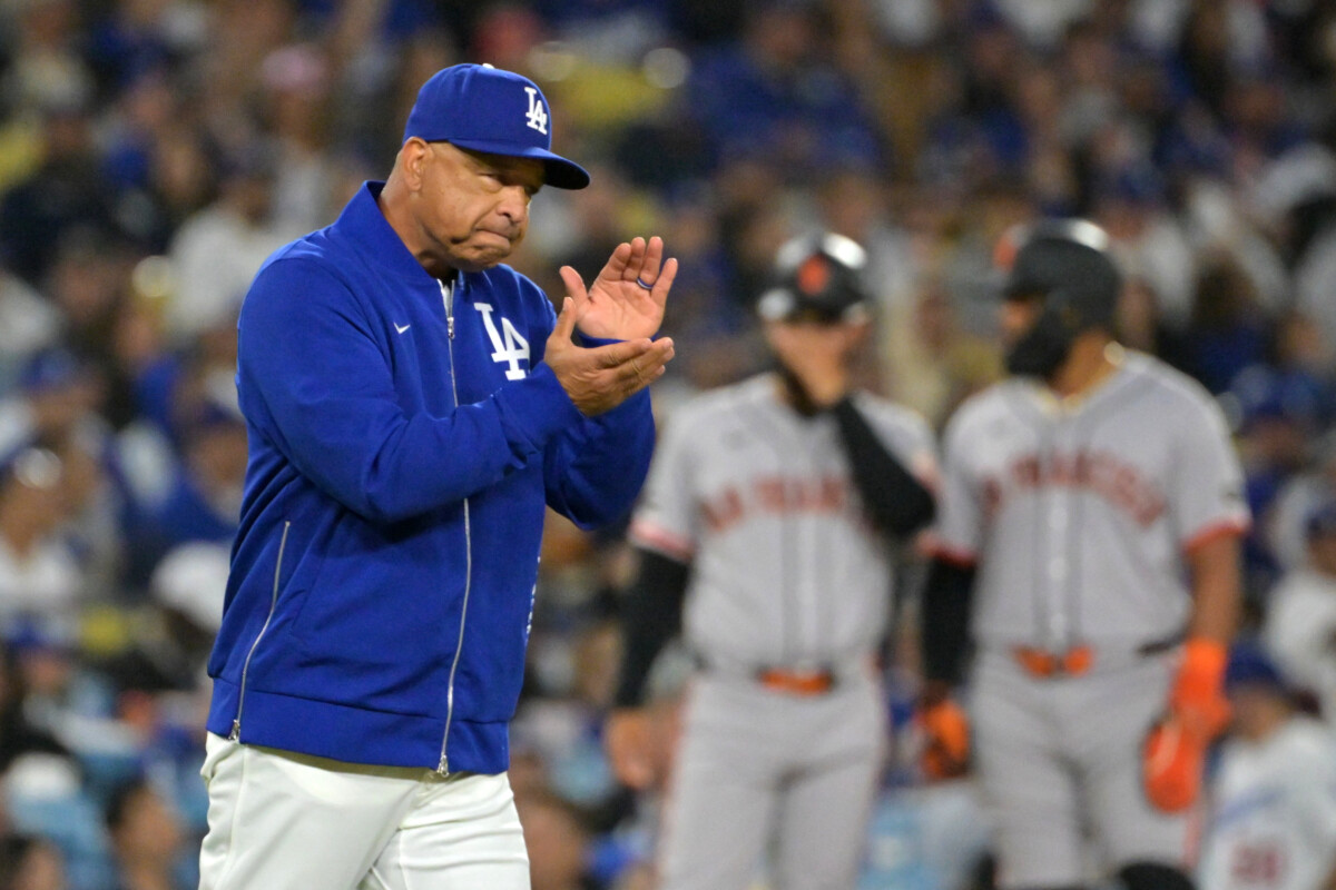 May 12, 2026; Los Angeles, California, USA; Los Angeles Dodgers manager Dave Roberts (30) reacts as he walks to the mound for a pitching change against the San Francisco Giants during the seventh inning at Dodger Stadium. Mandatory Credit: Jayne Kamin-Oncea-Imagn Images