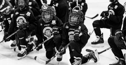 Respectful Protest: Hockey players taking a knee during the national anthem, symbolizing a peaceful protest and a call for social justice.
