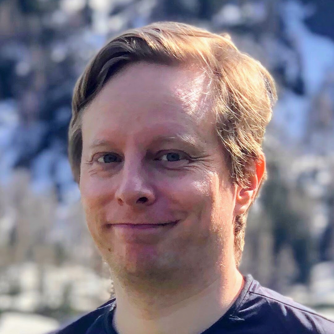 Portrait picture of a white man with dark blond hair