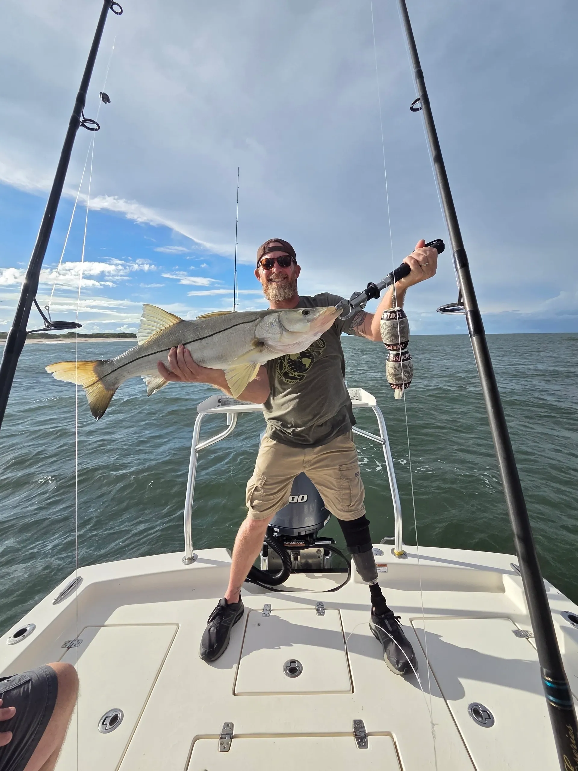 Fisherman proudly displaying big catch