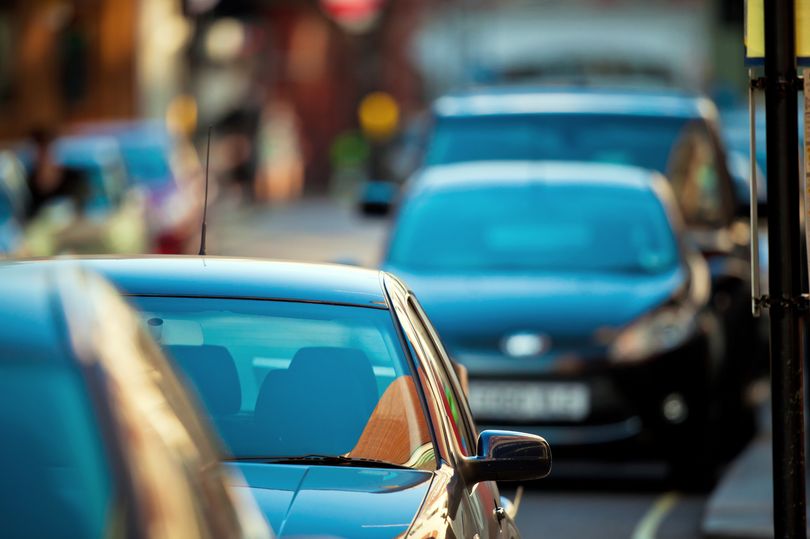 'Neighbour holds street parking space with cone and left note on my car when I refused'