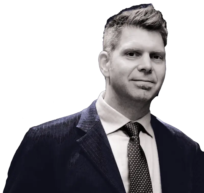A man in a suit and tie is posing for a photo in Canada.