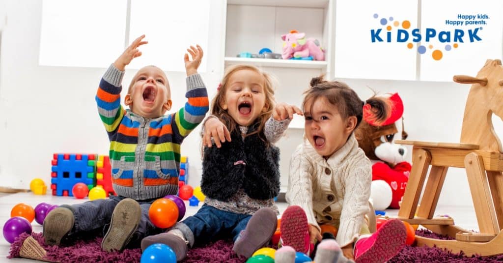 Three toddlers having fun at KidsPark, a daycare/ child care in California