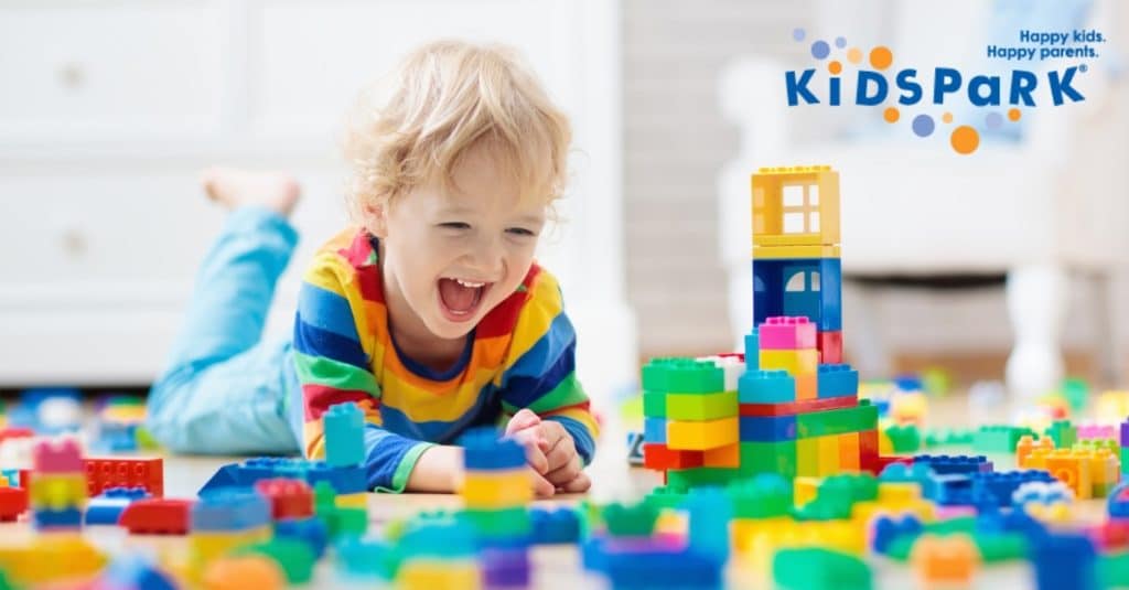 Little boy playing with blocks at KidsPark, childcare in California