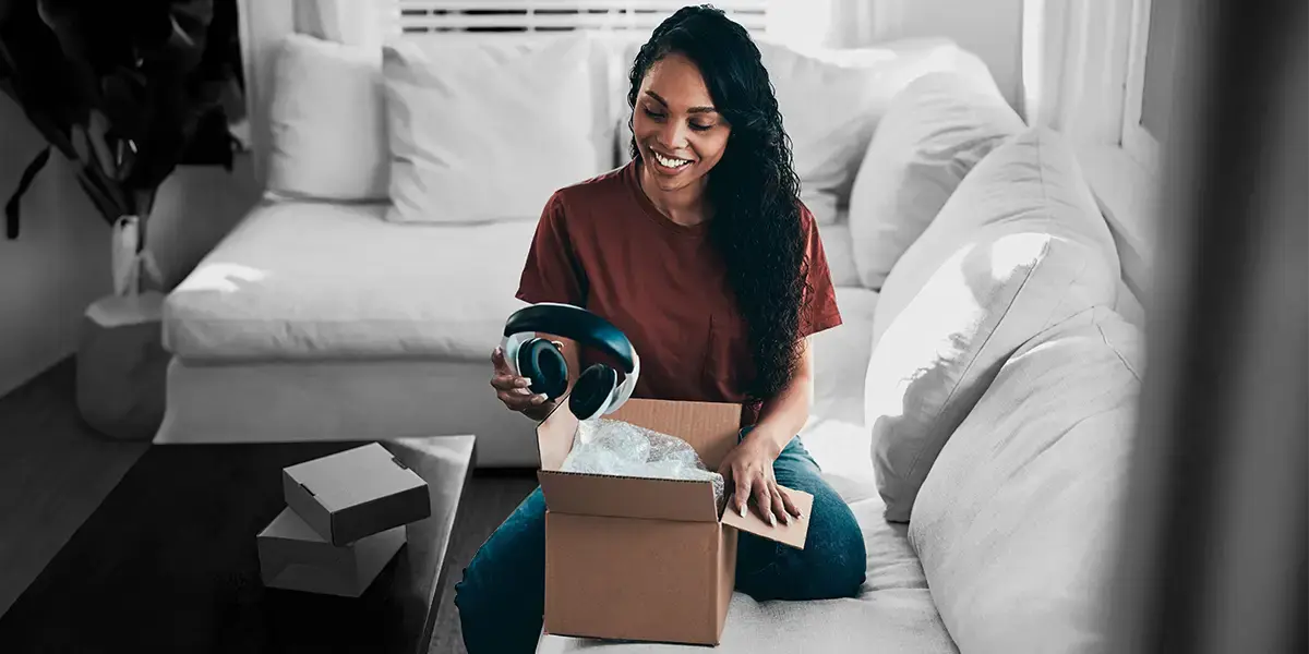 A customer unboxes a parcel delivered to their home