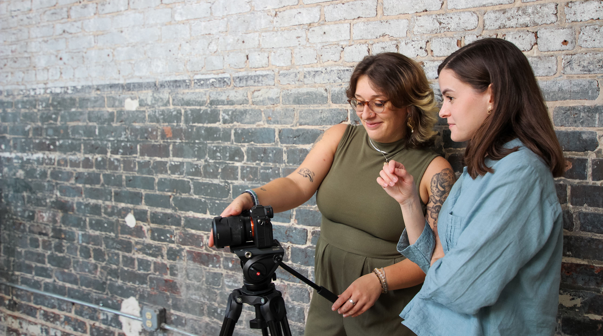 Erin and Claire from our Creative team setting up to film content.