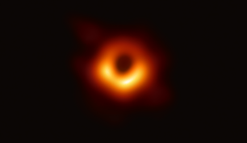 Bright ring of yellow-orange light against the darkness of space.
