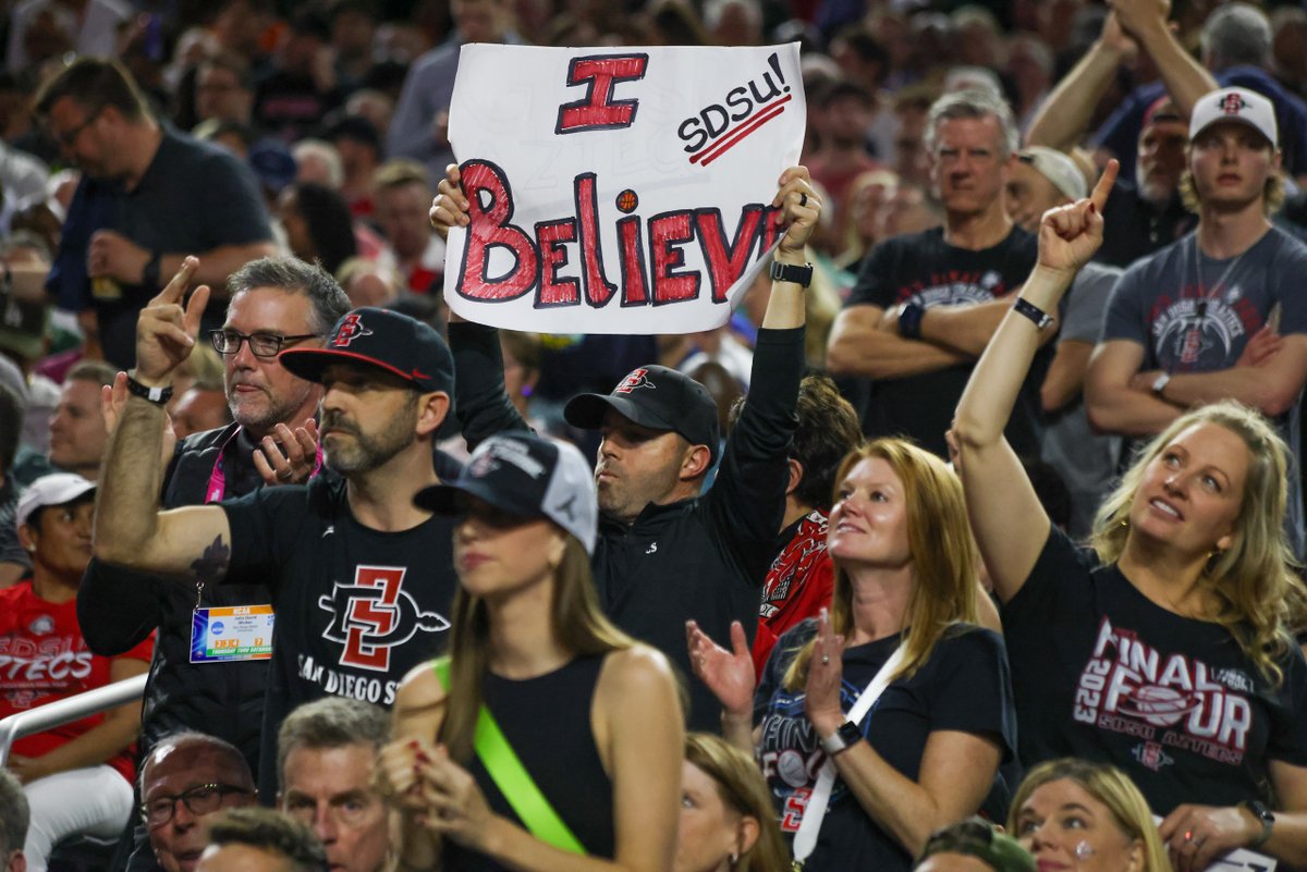 SDSU Fan with an "I Believe" Sign.

