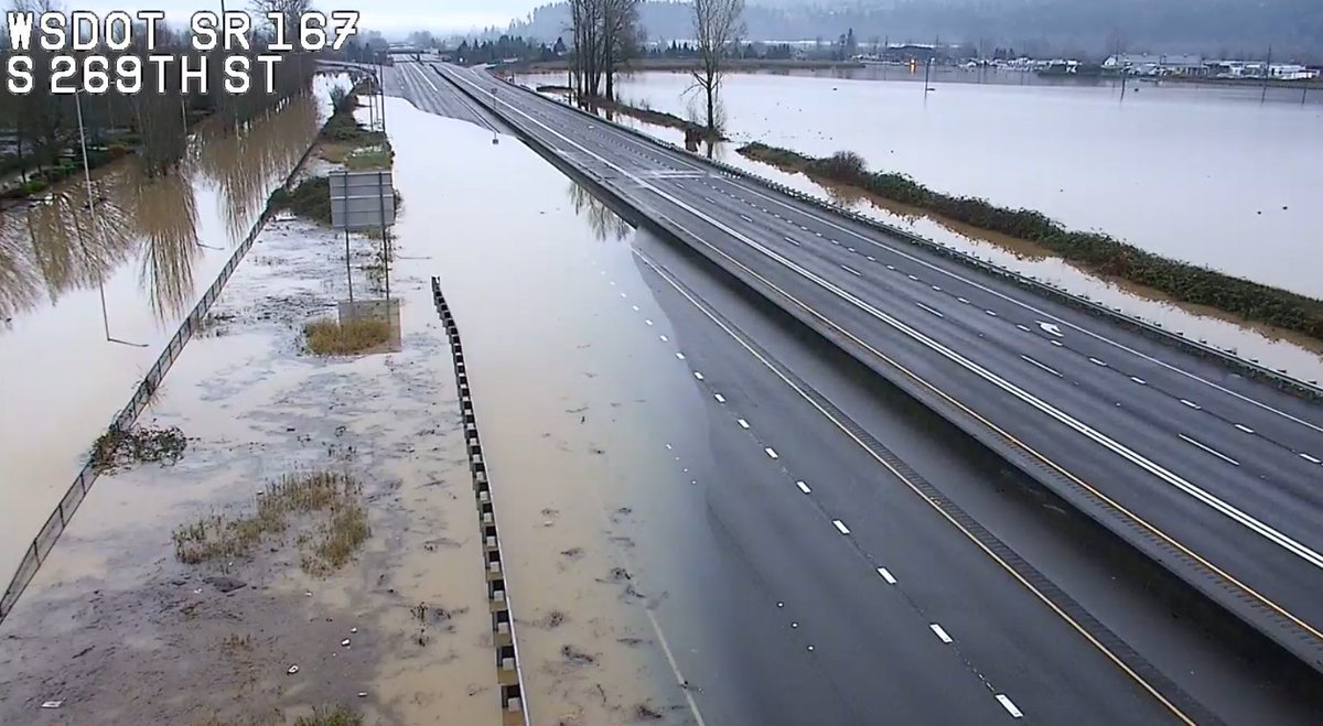 A daytime photo showing water over the roadway on SR 167 near S 269th St. 