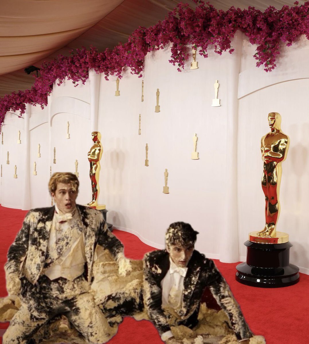 a photoshopped still from red white and royal blue to show the two main characters covered in cake on the oscars red carpet