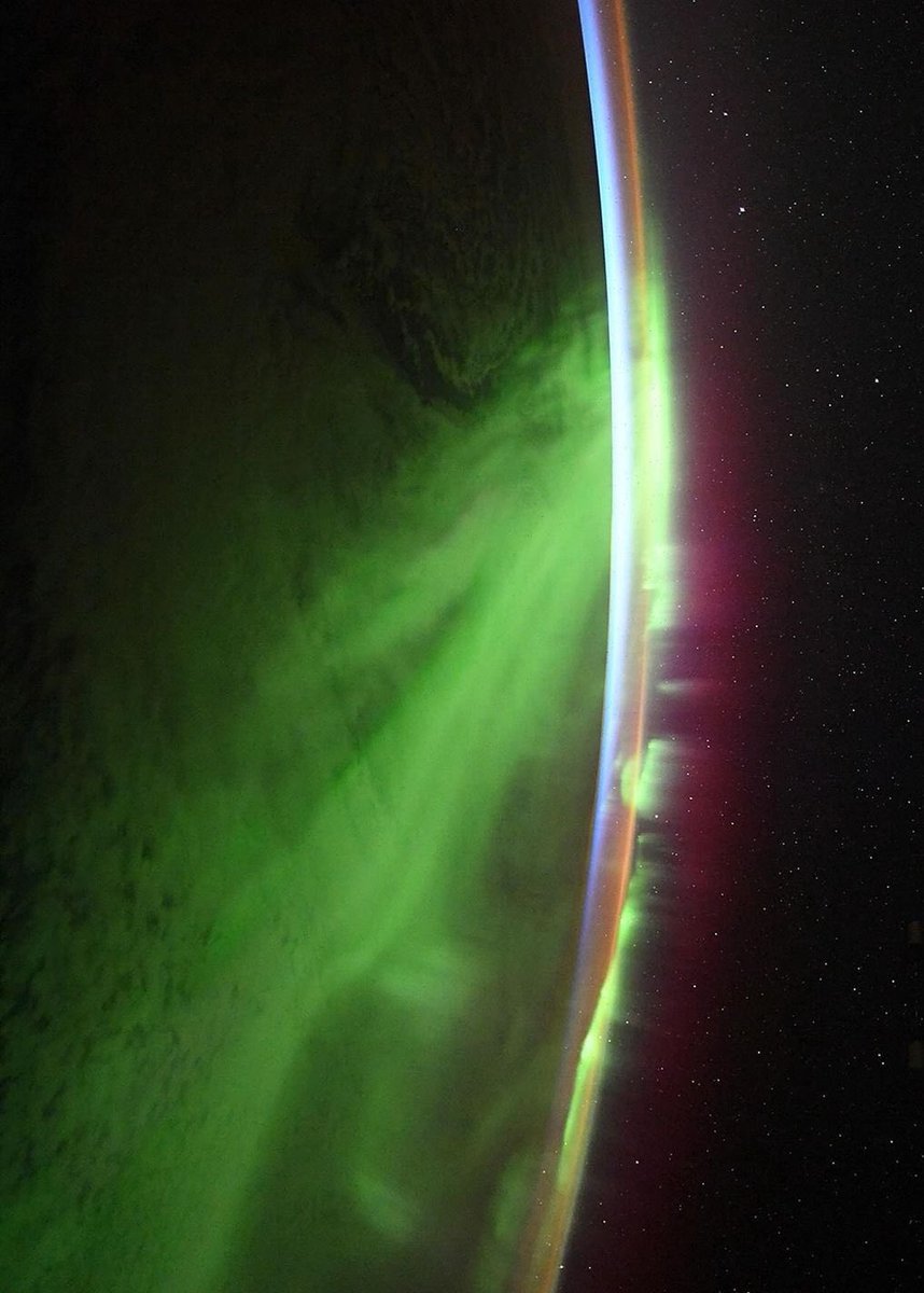 Earth’s aurora visible at night from the ISS. Many stars can be seen in the background.