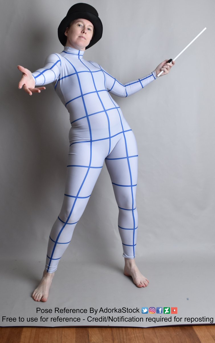 thin white female figure wearing a grid suit and a top hat holding a wand in one hand and the other reaching towards the camera