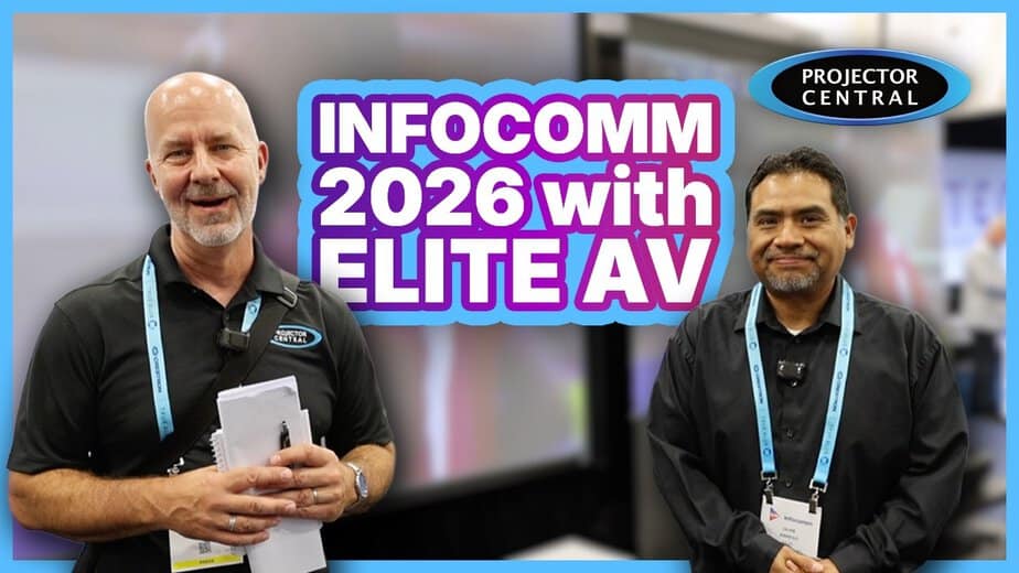 Two men at Infocomm 2026 showcasing projection screens and AV equipment.