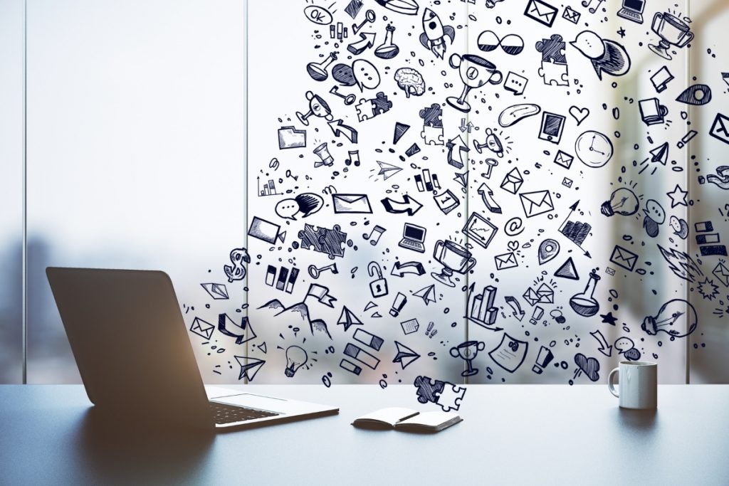 Icons flowing out of a laptop monitor
