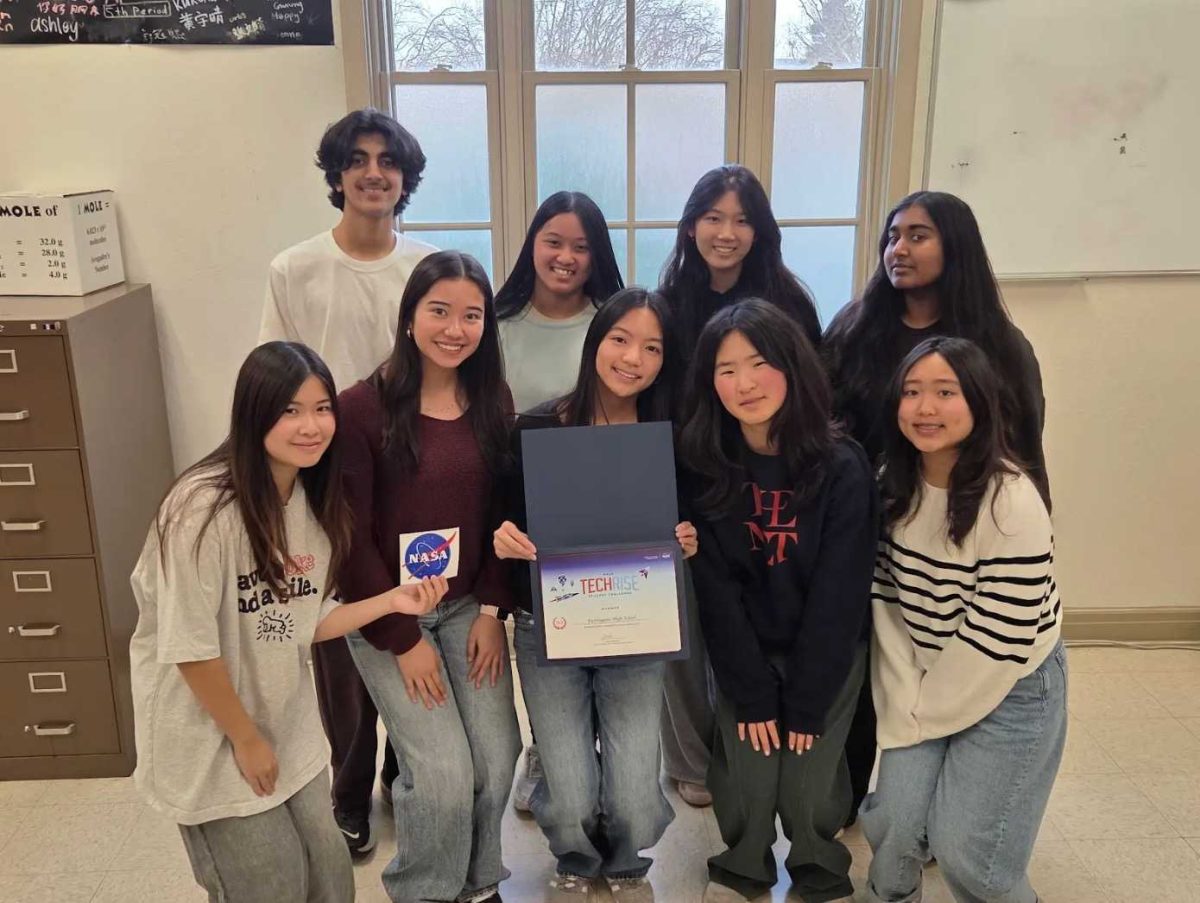 The group that worked on the National Aeronautics and Space Administration (NASA) TechRise Student Challenge poses with their plaque. Photo courtesy of Belle Tan