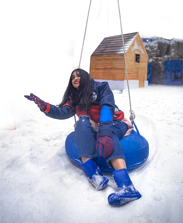 Girl enjoying snow tube ride at GRS Snow Park