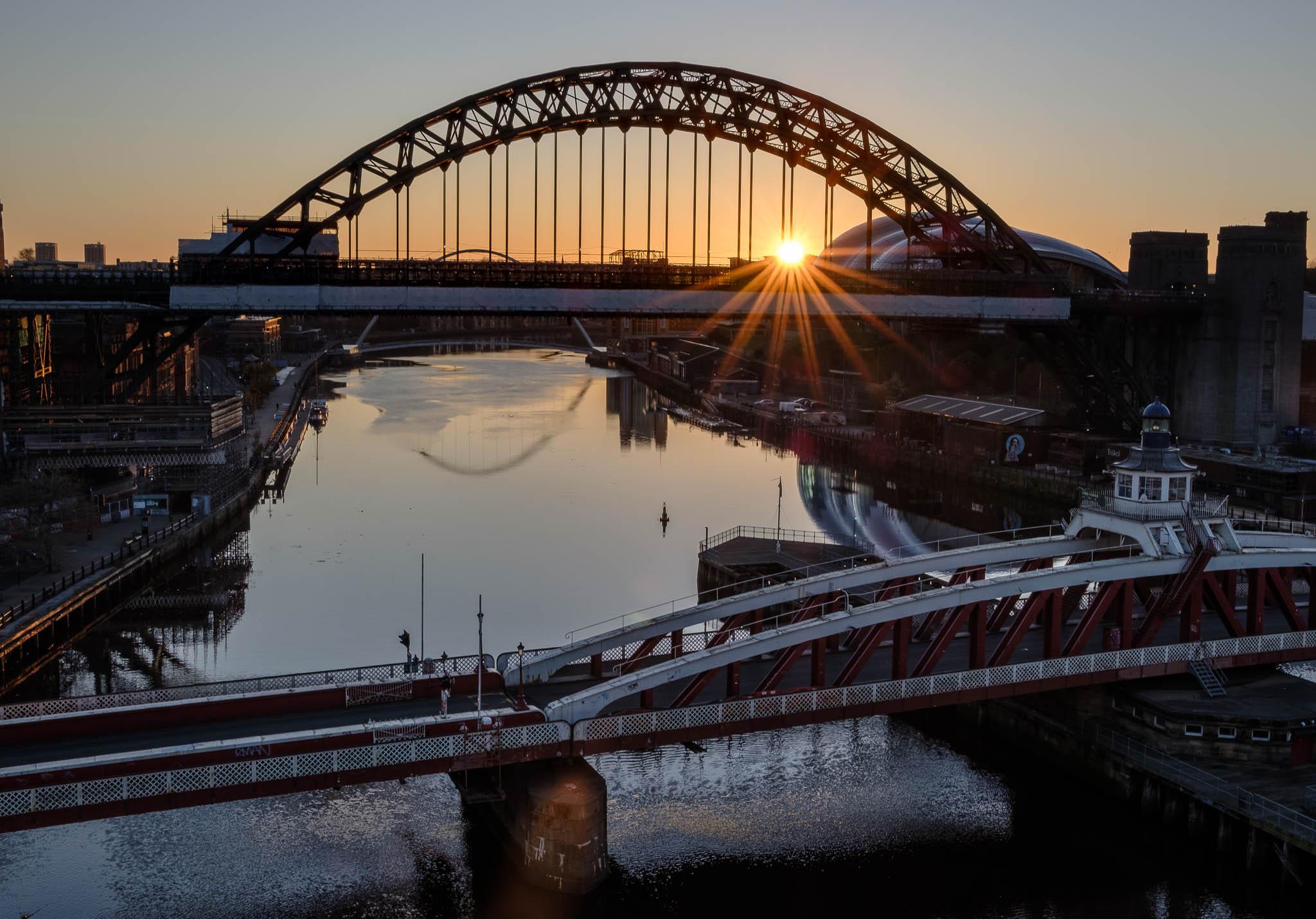 Sun rises behind the Tyne Bridges and Glasshouse in Newcastle and Gateshead