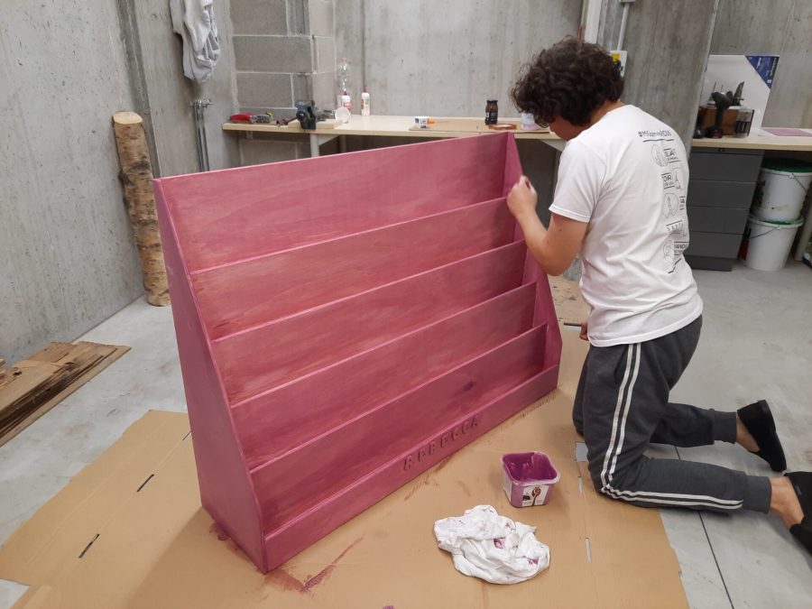 Locutus painting the Montessori bookshelf pink