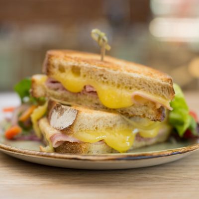 A sourdough toasted sandwich oozing with melted cheese