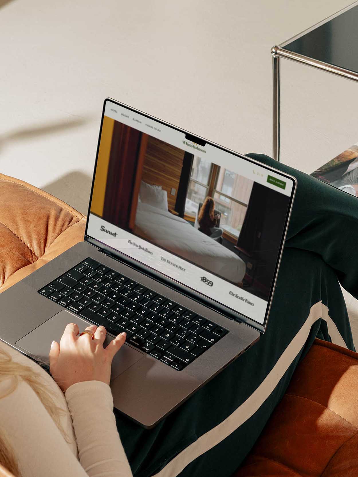 Woman viewing a hotel website on a laptop